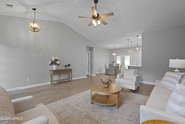 64 Grovewood Dr, Bluffton, SC 29910 - living area featuring wood finished floors, a chandelier, lofted ceiling, ceiling fan, and baseboards