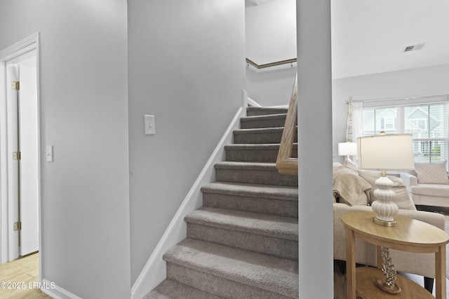 64 Grovewood Dr, Bluffton, SC 29910 - stairway with wood finished floors and baseboards