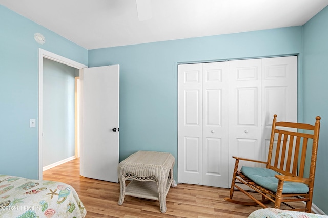 bedroom featuring a closet, ceiling fan, and light wood-type flooring