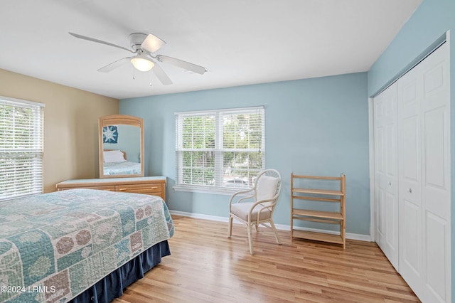 bedroom featuring ceiling fan, a closet, and light hardwood / wood-style flooring