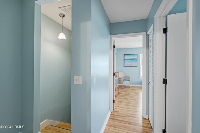 hall with light hardwood / wood-style floors