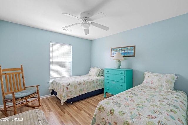 bedroom featuring light wood-type flooring and ceiling fan