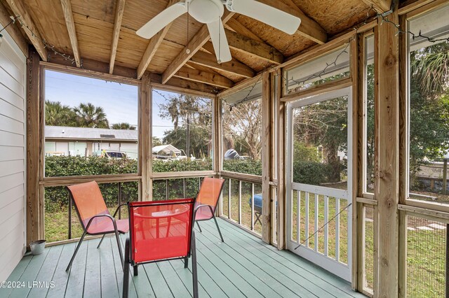 sunroom / solarium featuring ceiling fan