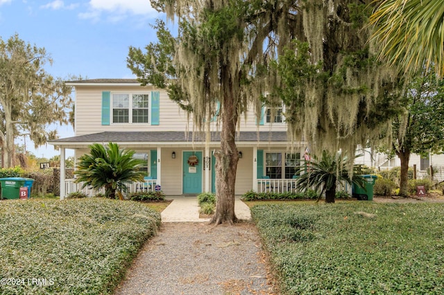 view of front of home with a front lawn and a porch