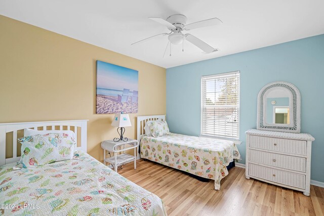 bedroom with hardwood / wood-style flooring and ceiling fan