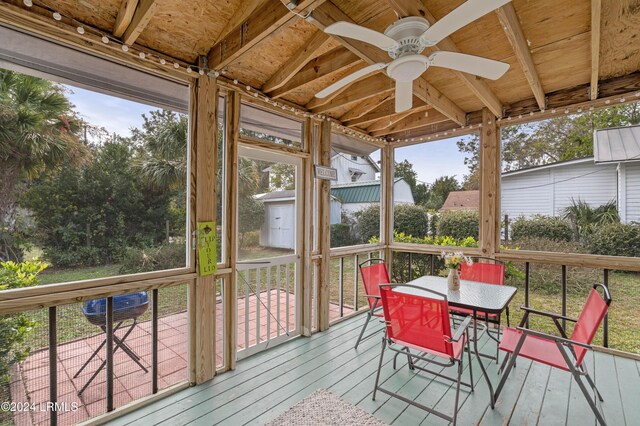 sunroom / solarium with ceiling fan and plenty of natural light