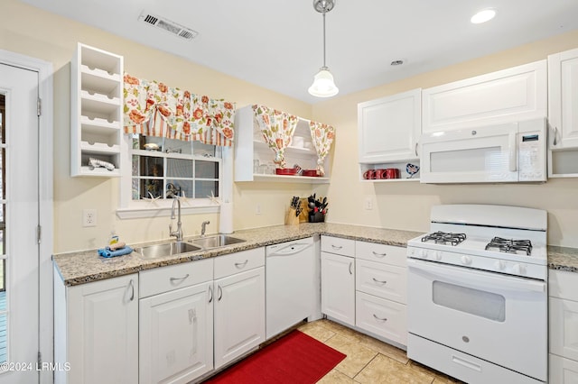 kitchen with white cabinetry, white appliances, decorative light fixtures, and sink