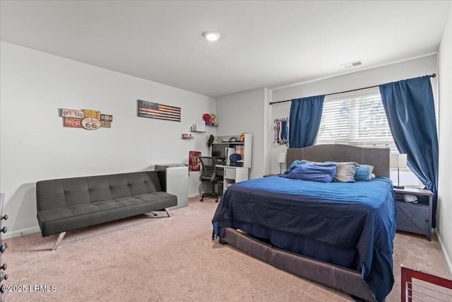 carpeted bedroom with baseboards and visible vents