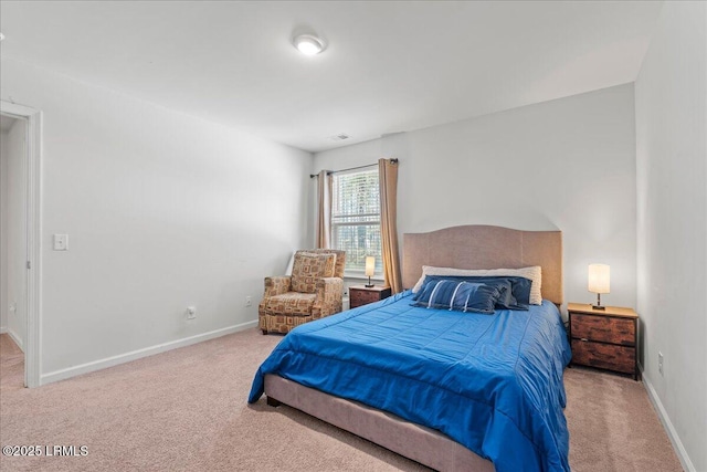 carpeted bedroom with baseboards