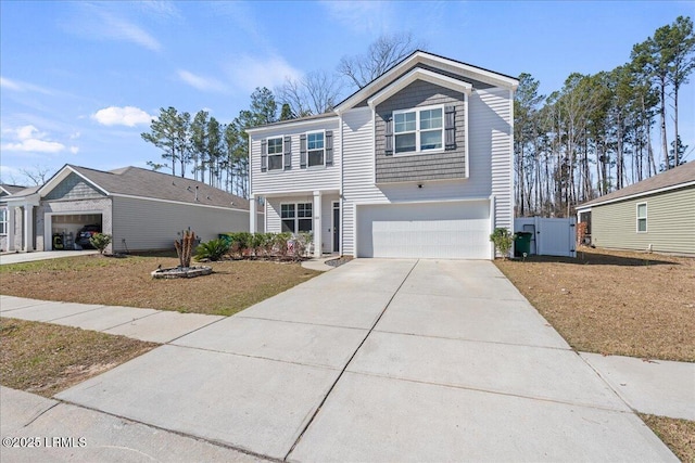 view of front of house with concrete driveway and a garage