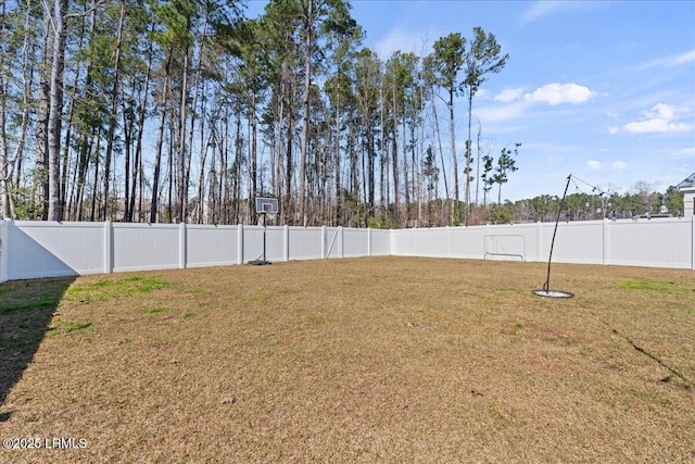 view of yard with a fenced backyard