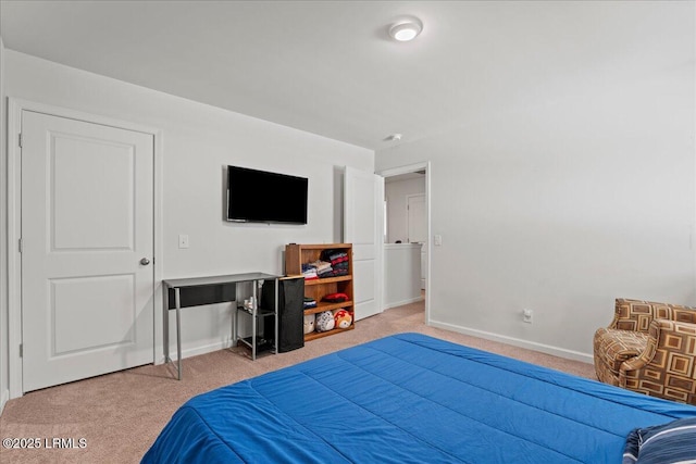 carpeted bedroom featuring baseboards