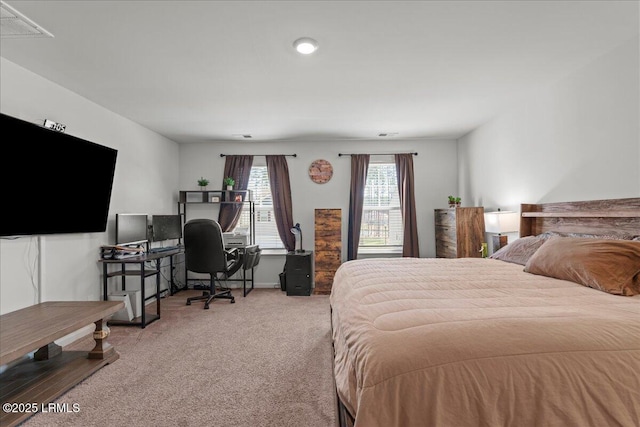 carpeted bedroom with visible vents