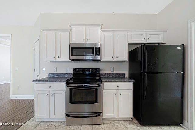 4 Applemint Ln, Beaufort, SC 29906 - kitchen featuring stainless steel appliances, dark countertops, and white cabinetry