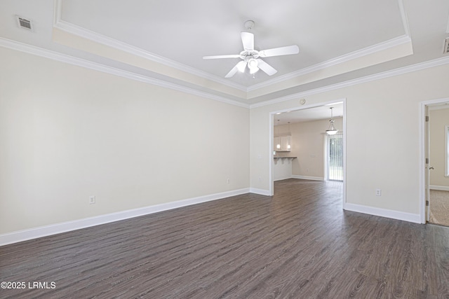 4 Applemint Ln, Beaufort, SC 29906 - empty room featuring dark wood-type flooring, a raised ceiling, ceiling fan, and crown molding