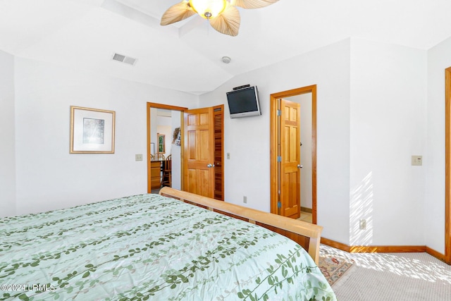 bedroom with vaulted ceiling, carpet floors, and ceiling fan