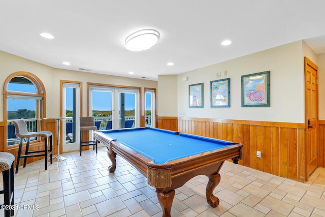 playroom featuring french doors, billiards, and wooden walls