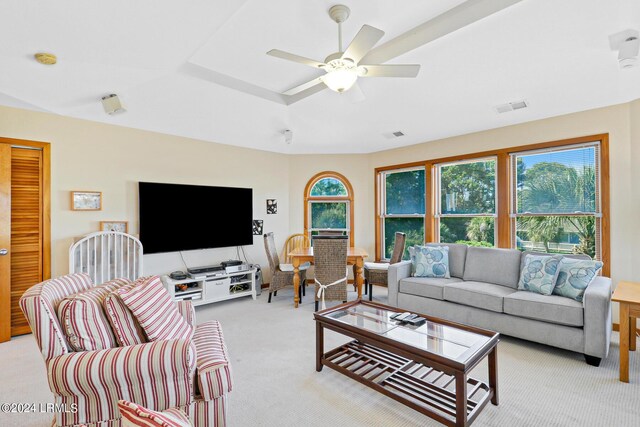 carpeted living room featuring ceiling fan