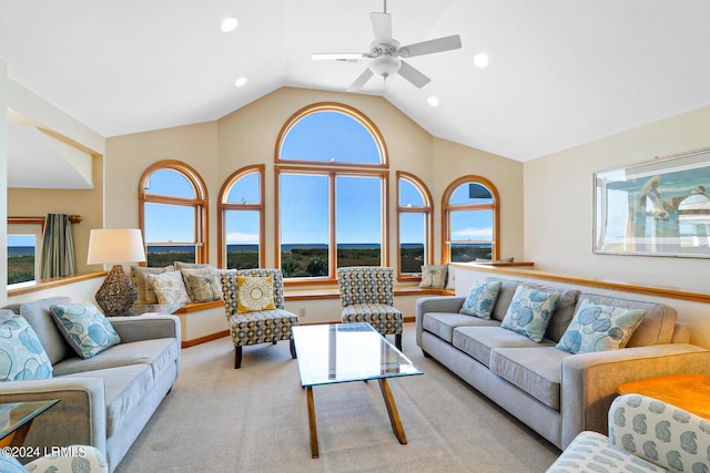 carpeted living room featuring lofted ceiling and ceiling fan