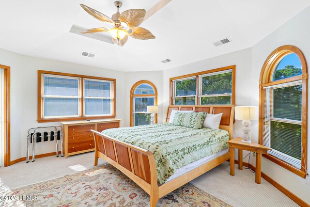 bedroom featuring light colored carpet and ceiling fan