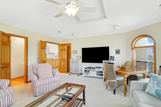 living room with ceiling fan and light carpet