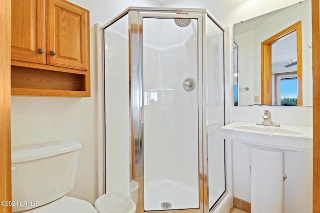 bathroom with toilet and walk in shower