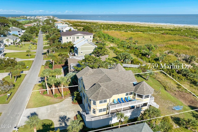 aerial view with a water view and a view of the beach