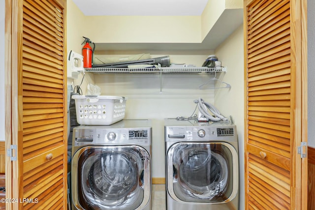 laundry area featuring independent washer and dryer and tile patterned flooring