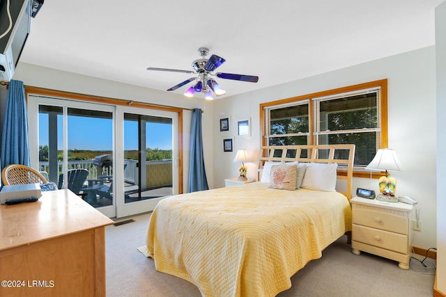 carpeted bedroom with access to exterior and ceiling fan