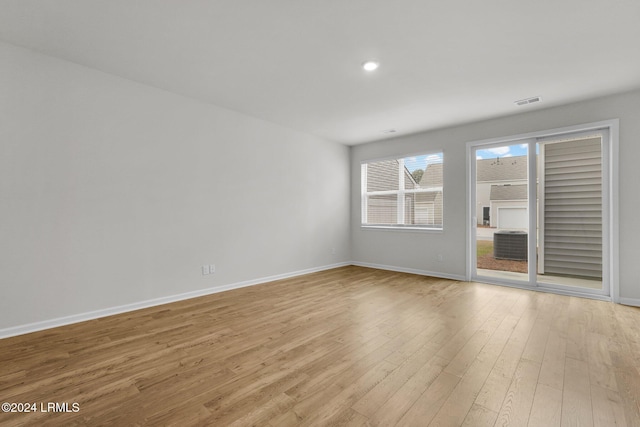 unfurnished room with light hardwood / wood-style floors