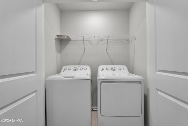 laundry room with separate washer and dryer