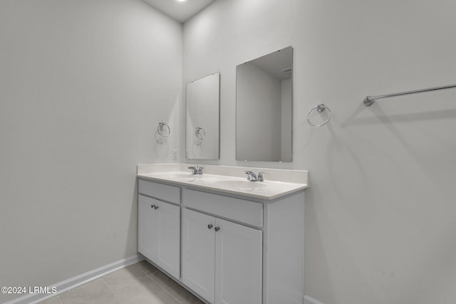 bathroom featuring tile patterned flooring and vanity