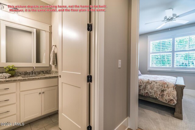 bathroom featuring vanity, tile patterned flooring, and ceiling fan