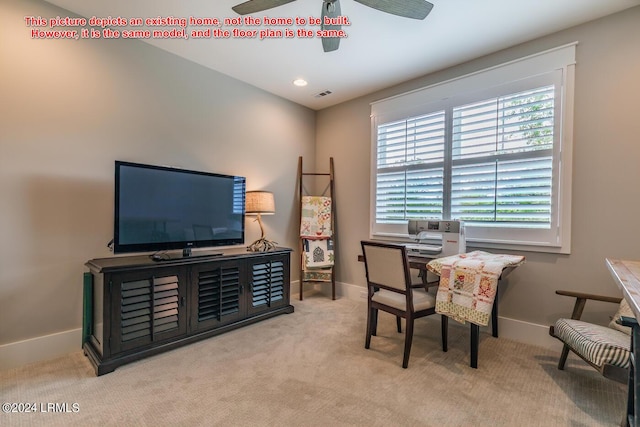 carpeted office space with ceiling fan