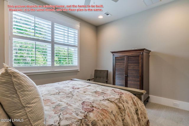 bedroom with multiple windows and light colored carpet