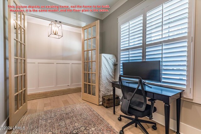 home office featuring hardwood / wood-style floors, ornamental molding, and french doors