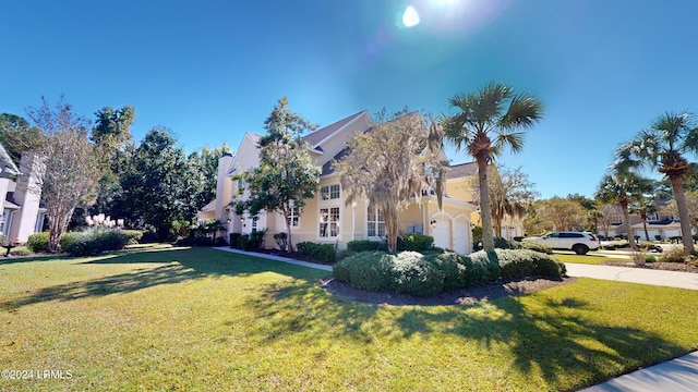 view of side of property featuring a yard