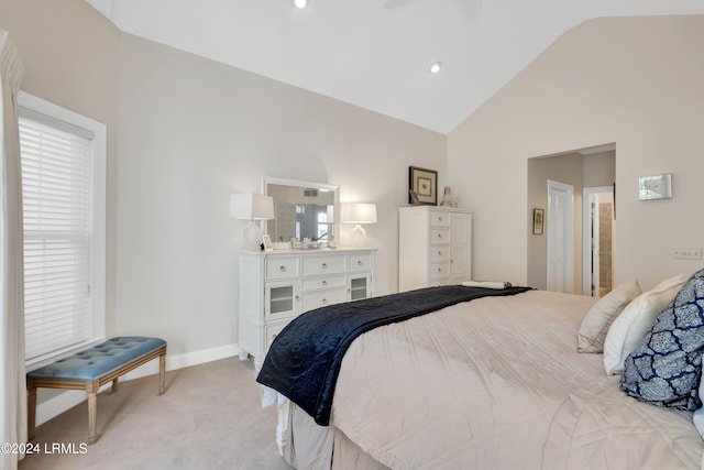 carpeted bedroom with vaulted ceiling and ceiling fan