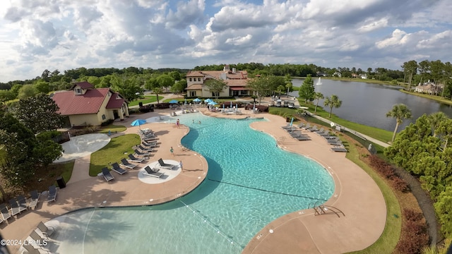 view of pool with a water view and a patio area