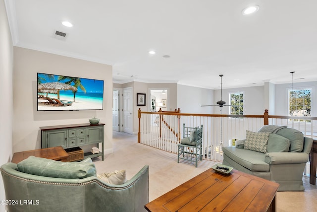 living room featuring crown molding and light colored carpet