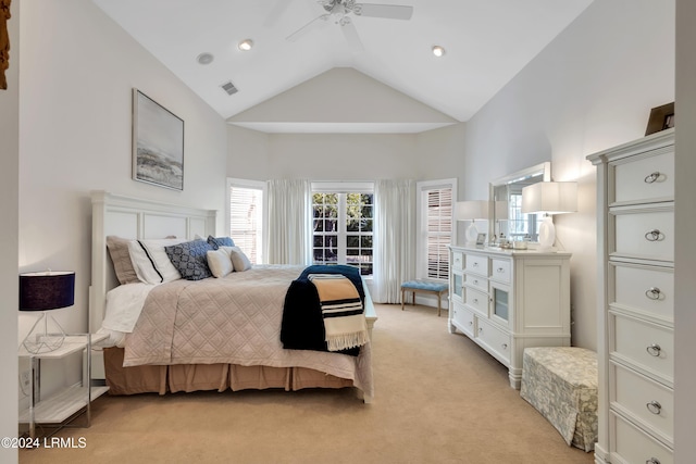 bedroom featuring high vaulted ceiling, light colored carpet, and ceiling fan