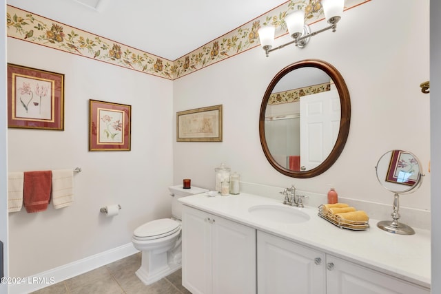 bathroom featuring vanity, toilet, and tile patterned flooring