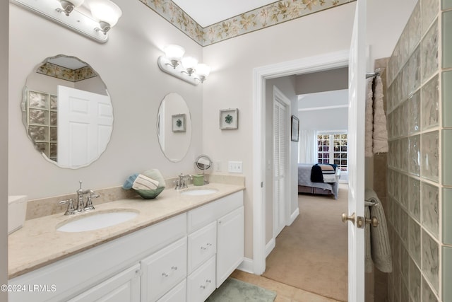 bathroom with tile patterned floors and vanity