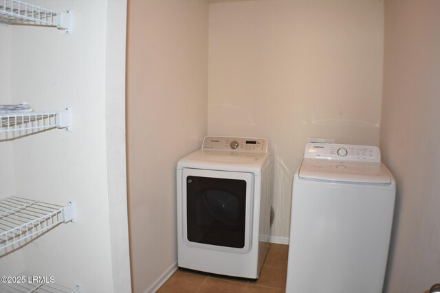 48 Pennyroyal Way, Beaufort, SC 29906 - laundry area featuring separate washer and dryer and tile patterned flooring