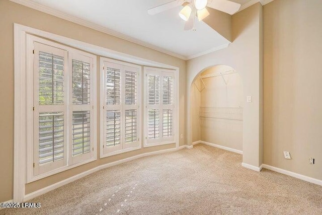 1 Wateree Ct, Beaufort, SC 29902 - unfurnished room featuring carpet, a ceiling fan, crown molding, and arched walkways