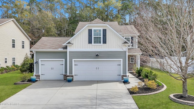 exterior space with concrete driveway, a garage, a lawn, and board and batten siding