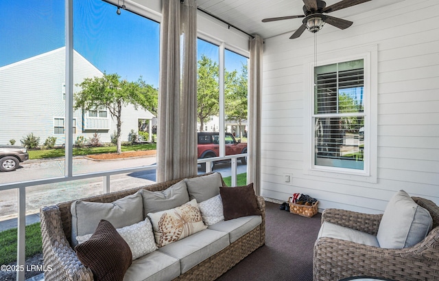 sunroom / solarium with ceiling fan