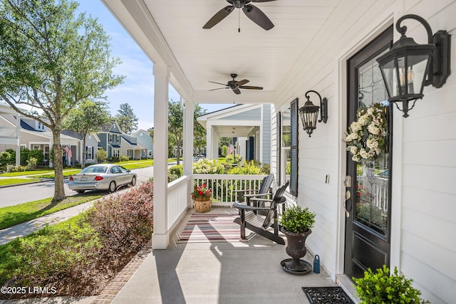 view of patio featuring ceiling fan and a porch