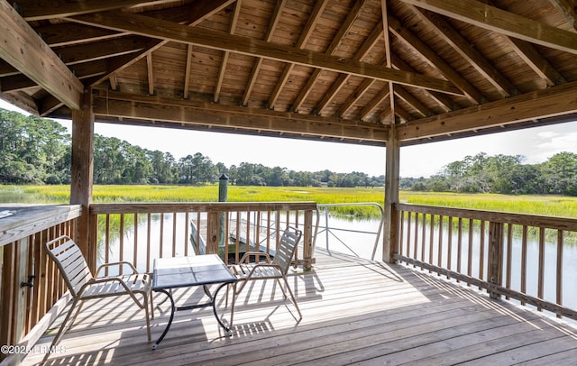 deck featuring a gazebo, a water view, and a rural view