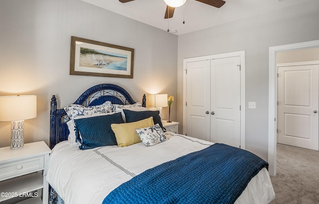 carpeted bedroom featuring ceiling fan and a closet